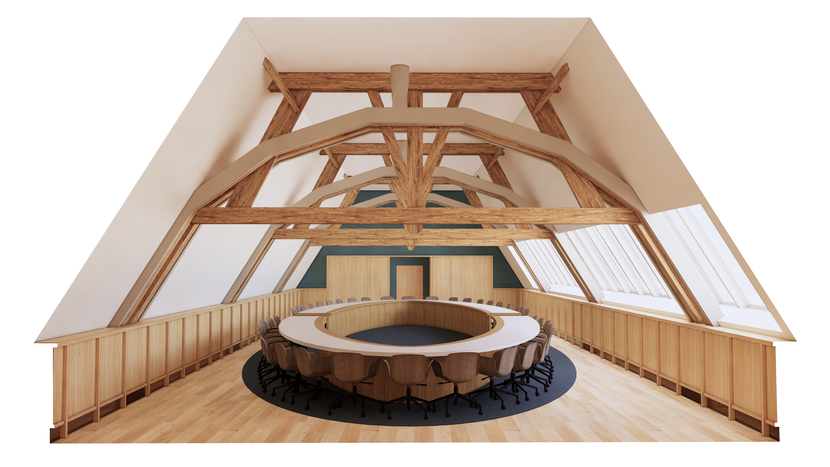 Impressie fractiekamer op zolder van gebouw J, met stoelen rond een grote, ronde tagel en dakspanten in zicht